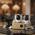 Four smart home security cameras on dark marble with jasmine flowers and gold leaf