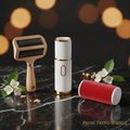 Three pet hair removal tools on dark marble with jasmine flowers and gold leaf